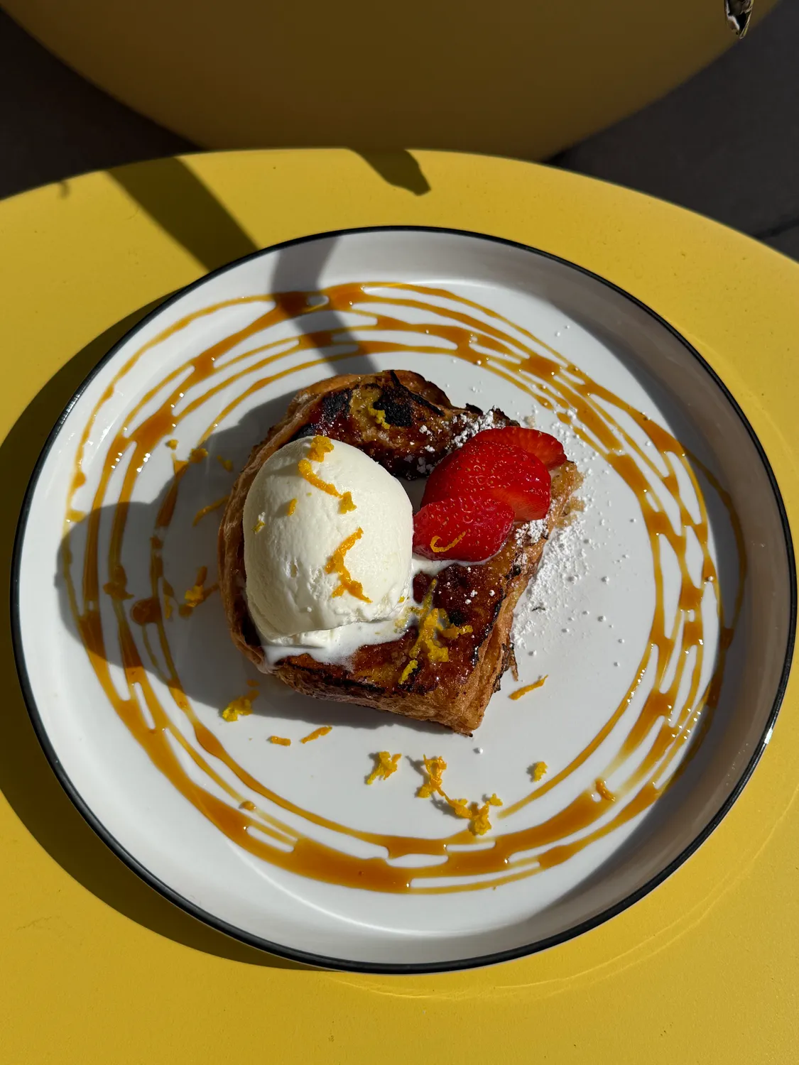 Brûlée French toast with vanilla gelato, strawberries and orange zest